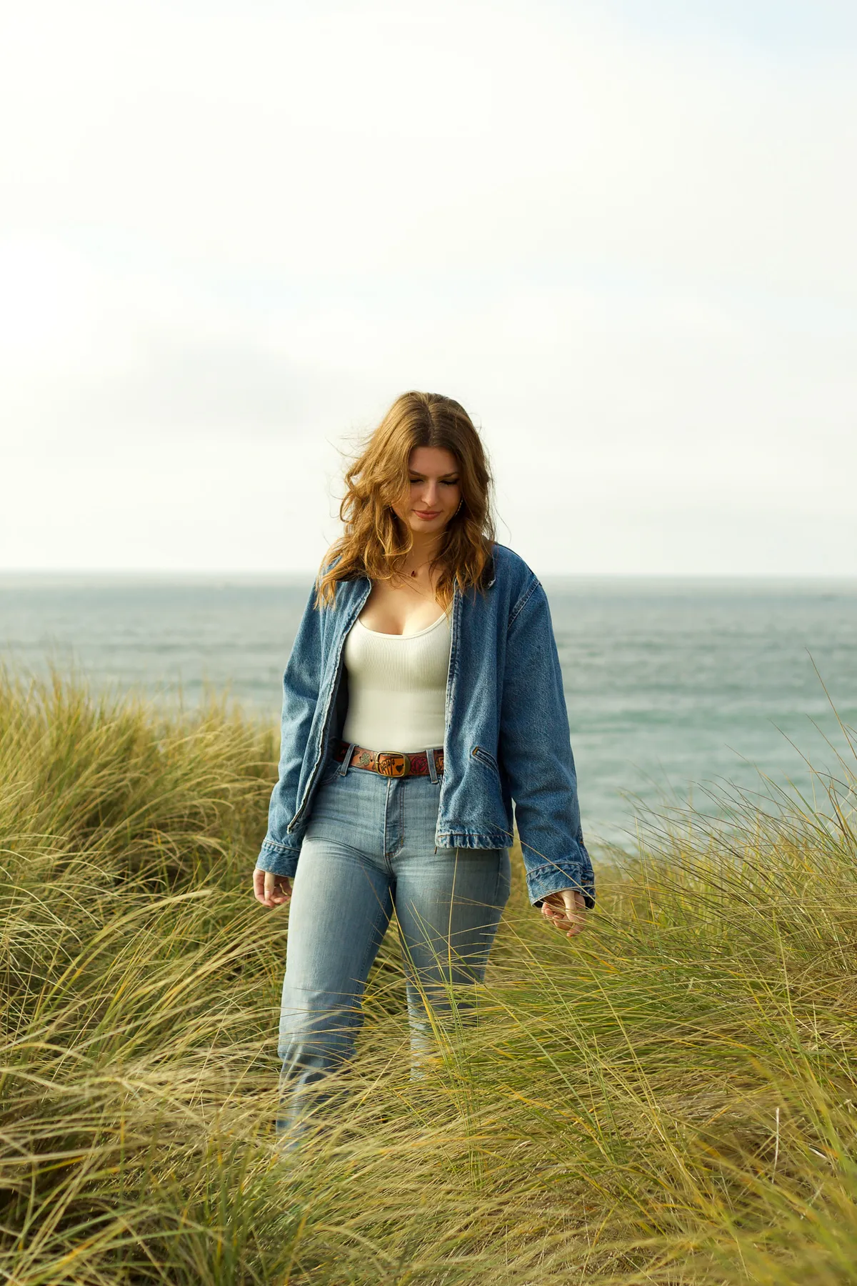 Natalya walking through dune grass